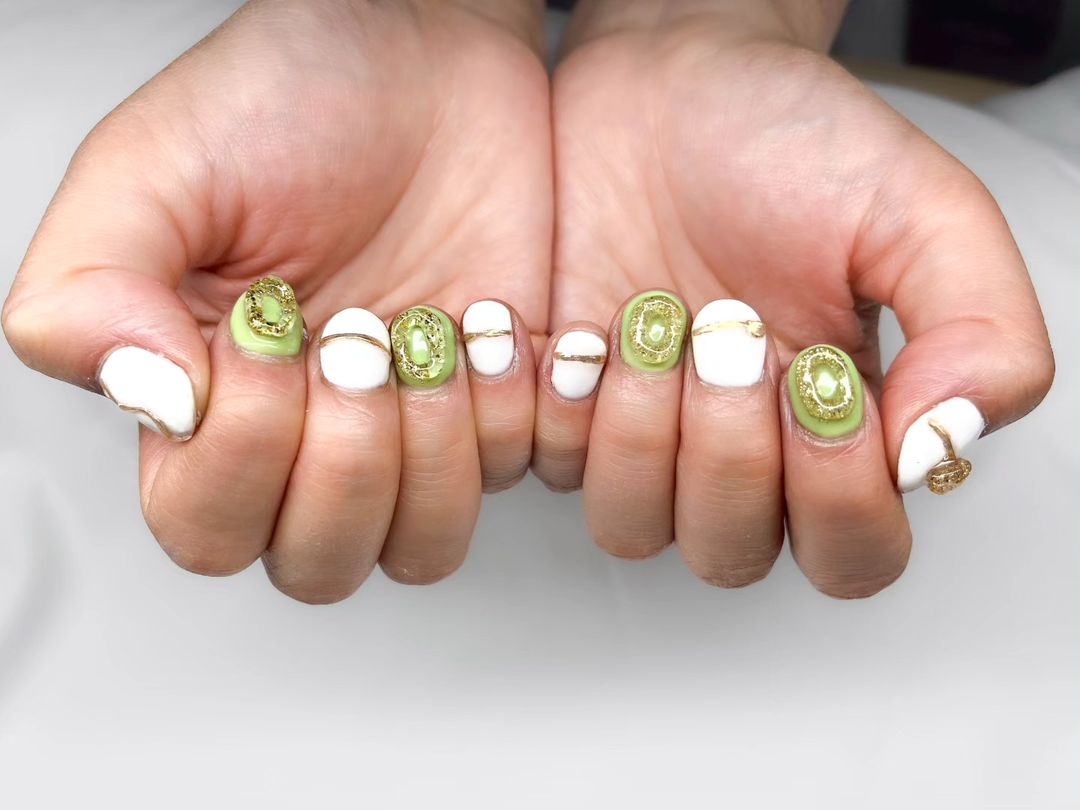 Green And White Nails With Acrylic Golden Lines