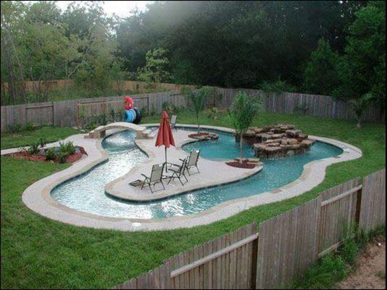 Lazy River Pool With Bridge, Fountain And Paved Island