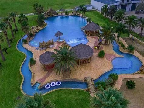 Lazy River Poool With Swimminb Area And Island With THree Hazebos And Cabanas