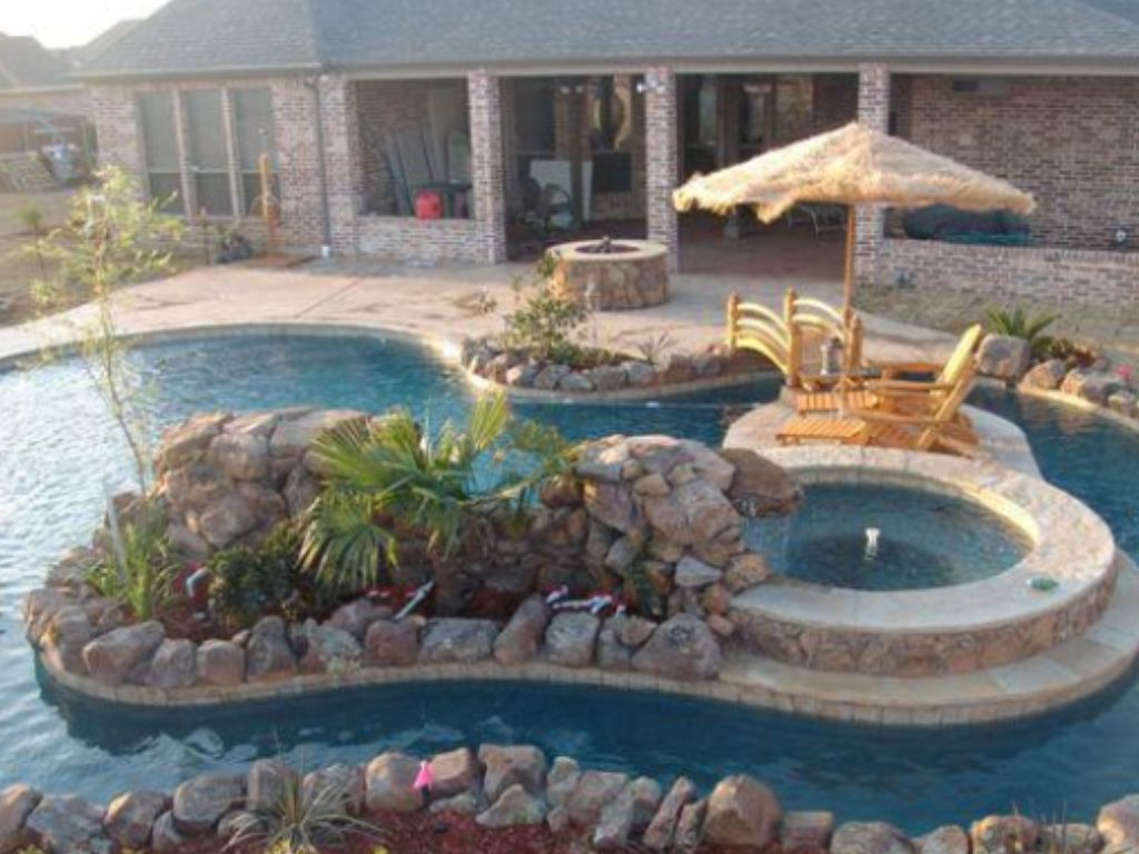 Lazy River With Wood Bridge And Stone Plantbed Island With Hot Tub