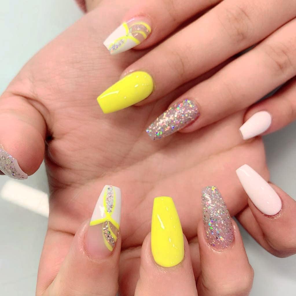 Nude And Yellow Nails With Colorful Glitter