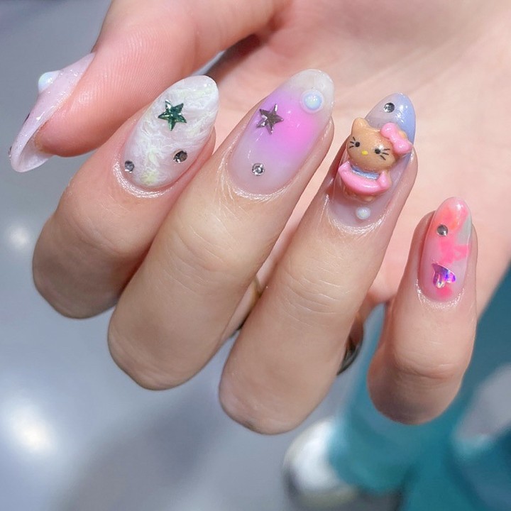 Pastel Nails With Glitter Stars And 3D Hello Kiity