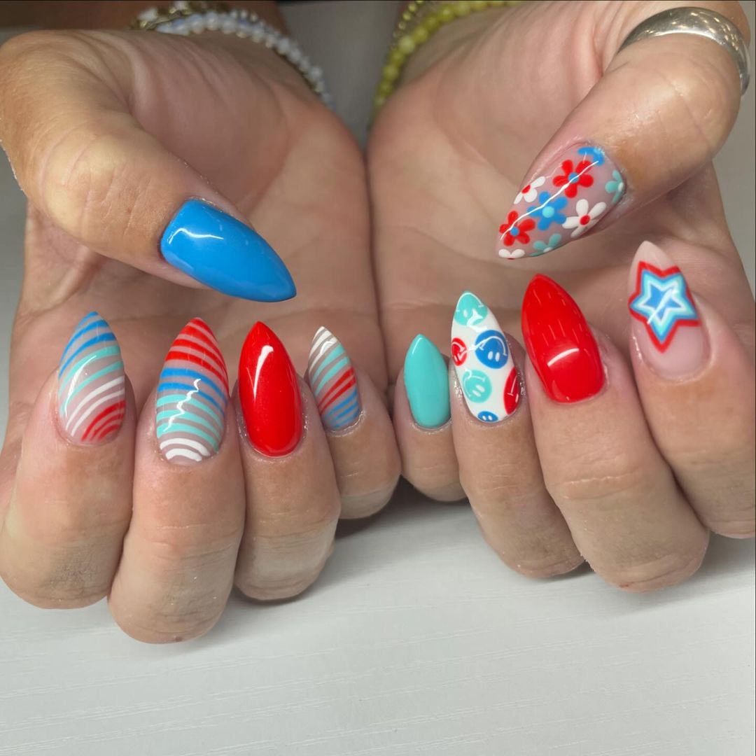 Red White And Blue Amond Nails With Stripes, Smiley Faces And Flowers