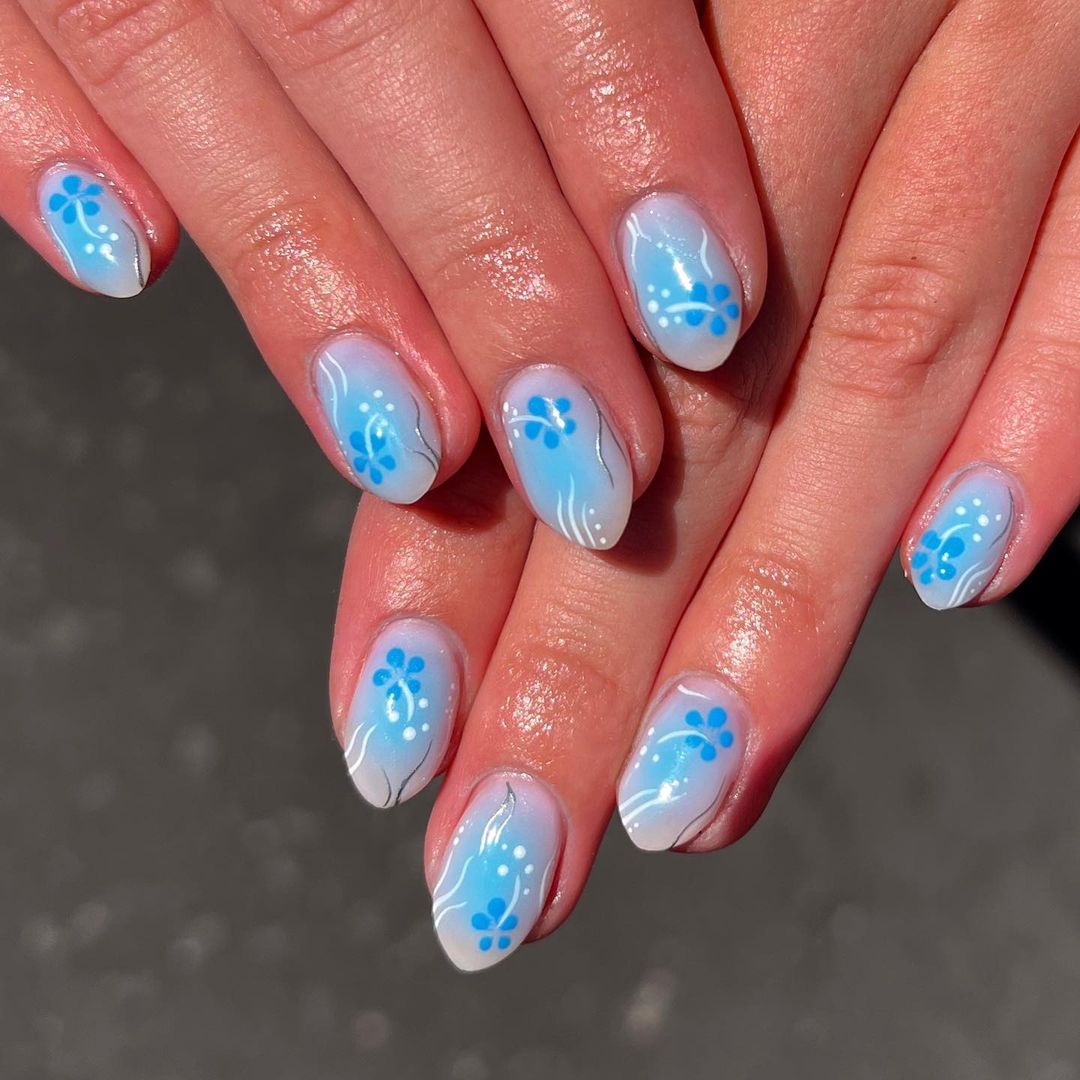 Short Baby Blue Oval Nails With Blue Hibiscus