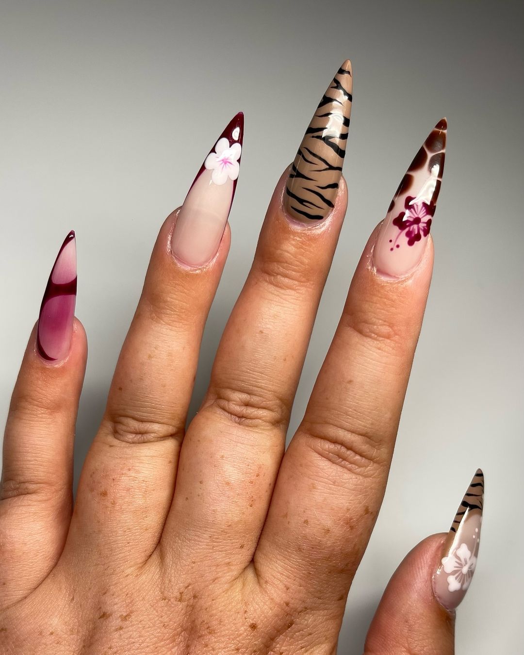 Stilleto Nails With Tiger Print With Dark Pink And White Hibiscus Flowers