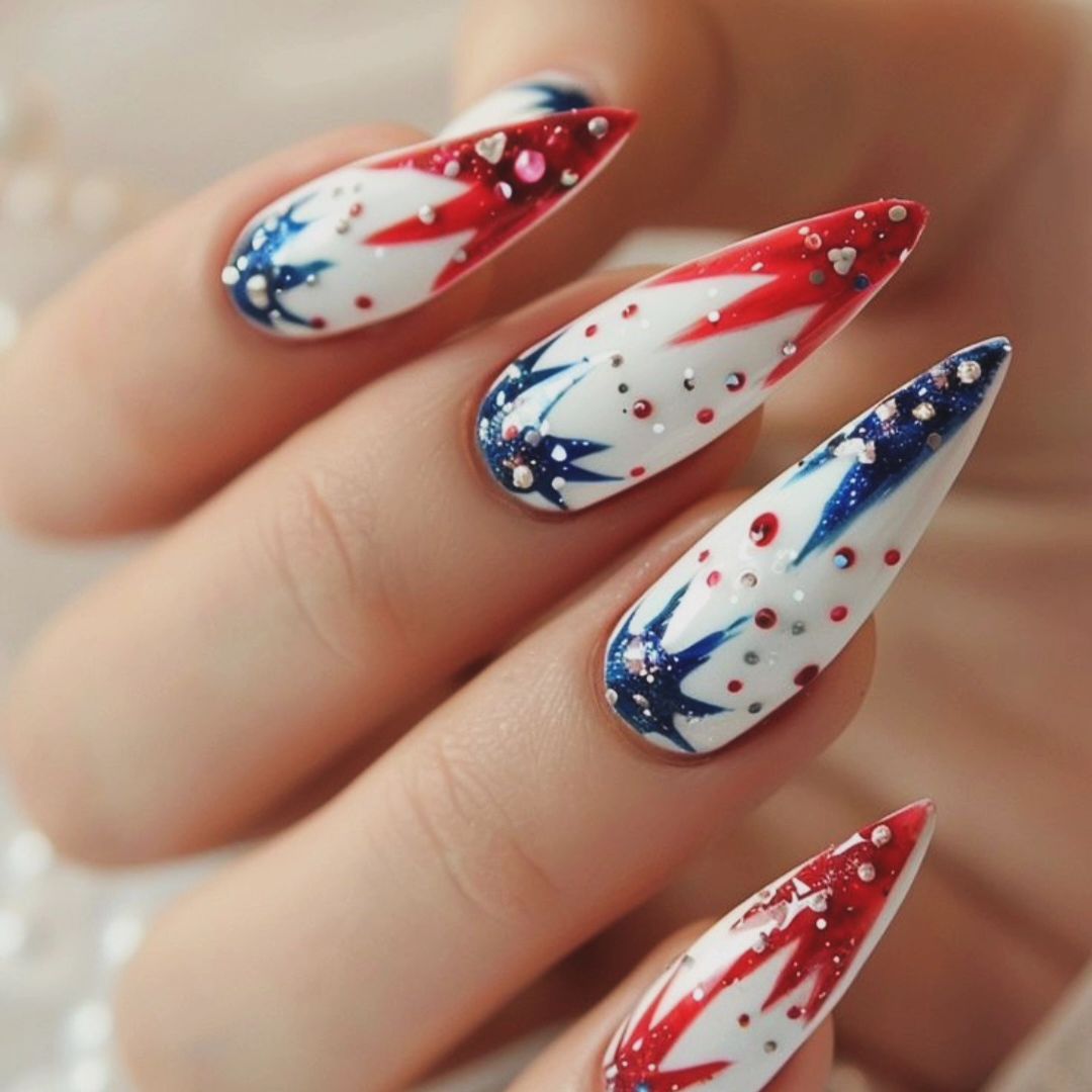 White Stilleto Nails With Blue And Red Fireworsk Design