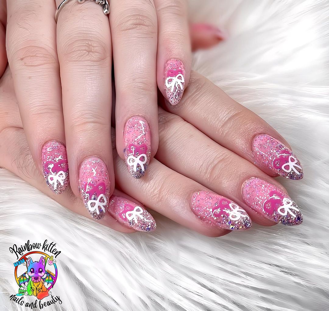 Almond Pink Glitter Nails With Bow Designs