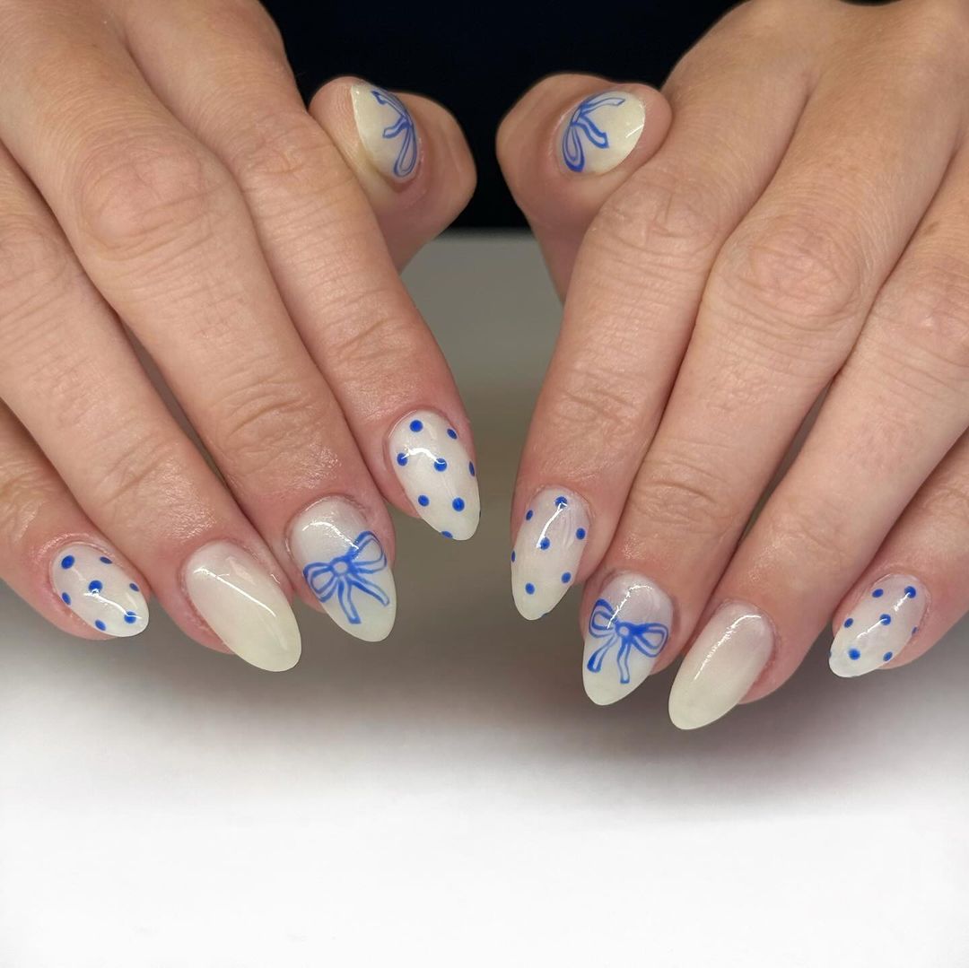 Blue Polka Dots and Bows On Nude Oval Nails