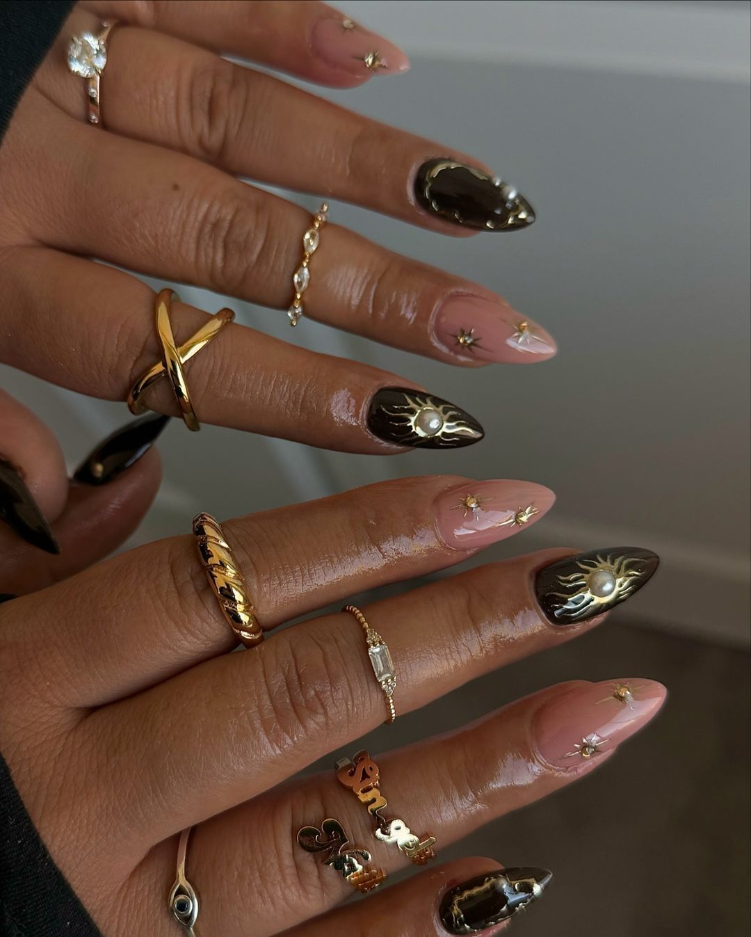 Clear And Black Stilletto Nails With Gold And PEarl Details