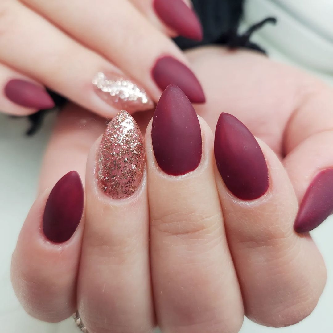 Matte Burgundy Stilleto Nails With Gilden Glitter Accent