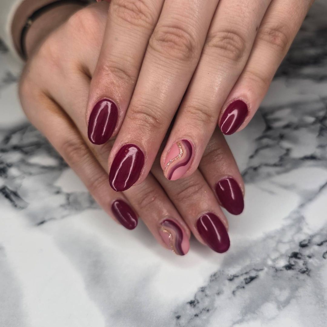 Oval Burgundy Nails With Nide Lined Accent Nail