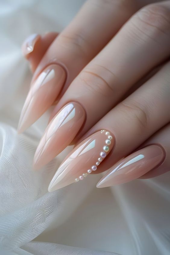 Pale Peach Stilleto Nails With Pearl Rim