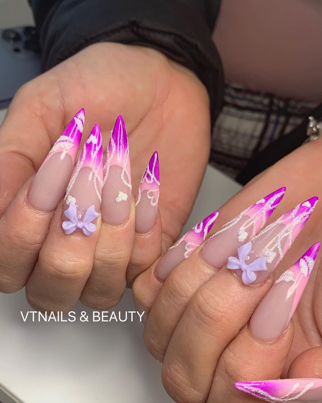 Pink and Purple Stiletto Nails With glitter Lines and 3D Bows