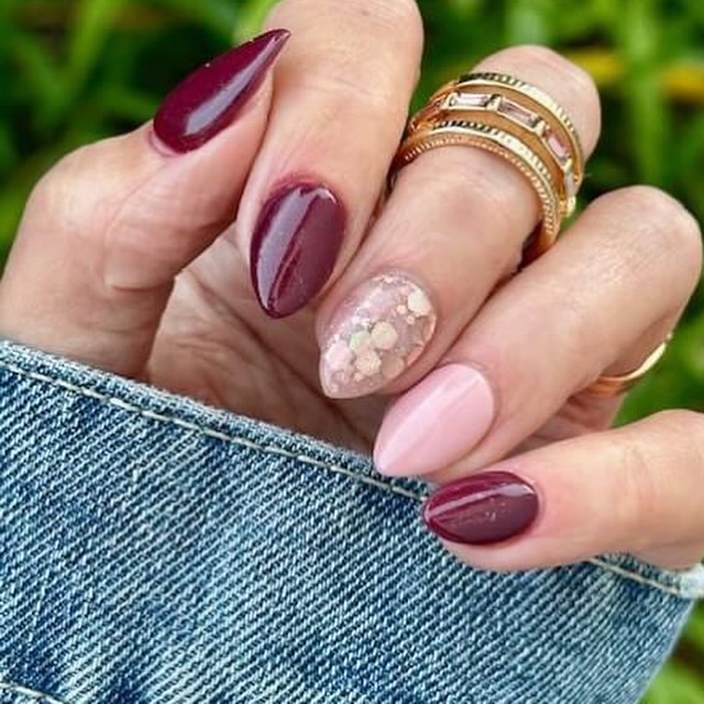 Short Almond Burgundy Nails With Pale Pink Conffetti