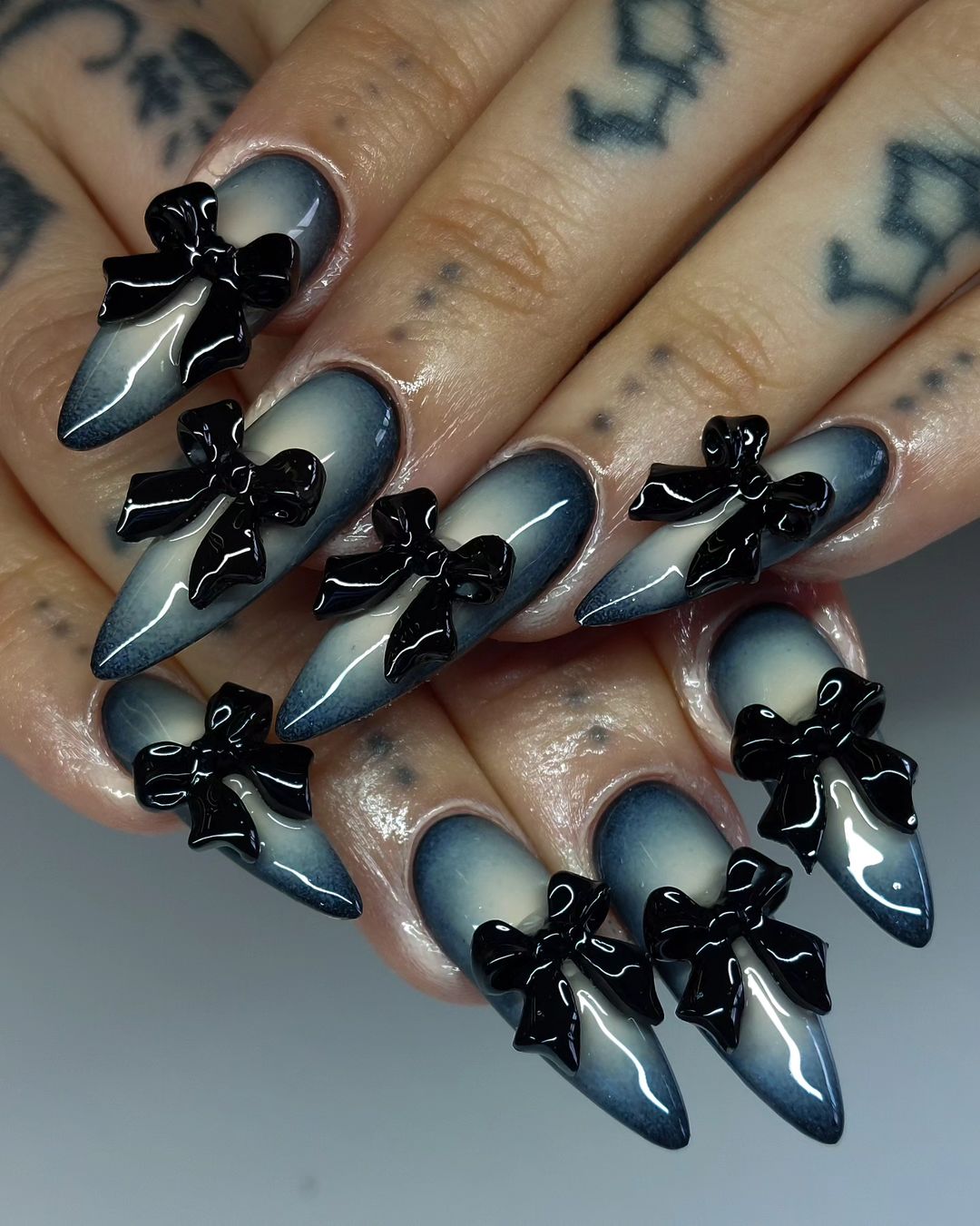 Stiletto Gray Aura Nails With Black 3D Bow