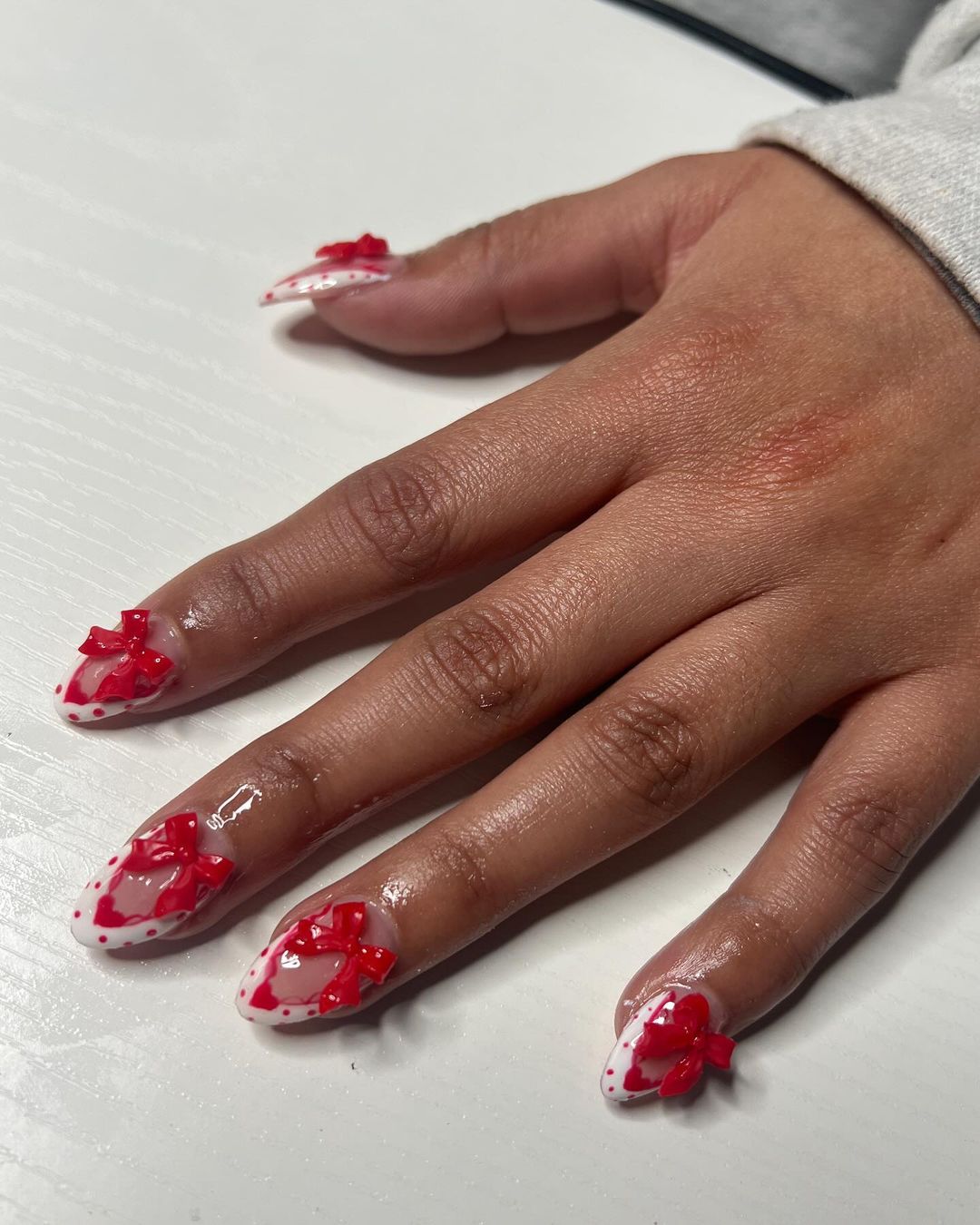 White And Red Polka Dot French Mani With Red 3D Bow