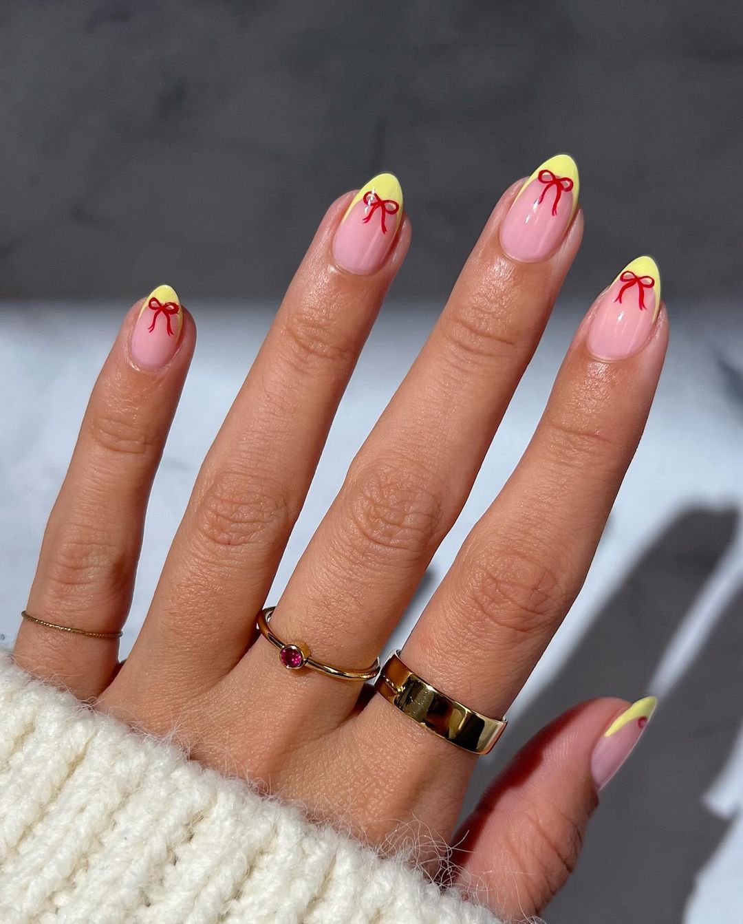 Yellow French Mani With Red Bow On Short Oval Nails